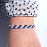 Glass beaded bracelet, summer jewelry of tiny blue, white and gold-color beads, adjustable loom bracelet with lobster claw clasp