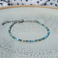Thin agate bracelet in shades of light blue and gray with tiny silver-plated beads, stainless steel lobster claw clasp