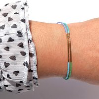 Thin miyuki wrapped stretch bracelet with blue, green and gold-plated tiny beads, minimalist summer jewelry