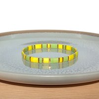 Miyuki tila stretch bracelet in light yellow and chartreuse green colour with gold-plated beads, two bracelets in sunny spring colors