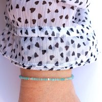 Thin gem bracelet with tiny faceted light blue-green jade and silver-plated cube-shaped beads, stainless steel lobster claw clasp