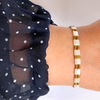 Elegant Japanese miyuki glass beads bracelet strung on transparent stretch cord - comfortable enough to wear every day yet elegant in a subtle way.  Two strands with white tila beads and the tiniest size rocailles in golden olive green and gold color  Wear alone for an understated minimalist look or add to your bracelet stack for a boho look  All our jewellery is handmade with care and attention to detail in Amsterdam, The Netherlands. This bracelet is made to order at your size.
