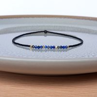 Thin miyuki stretch bracelets with blue sodalite, matte tiny glass beads and gold-plated beads, three designs in minimalist style