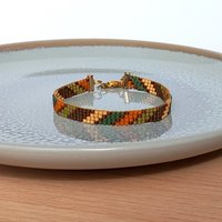Glass beaded bracelet made with tiny beads in earth tones, stylish adjustable loom bracelet with lobster claw clasp
