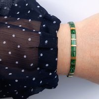 Glass tile stretch bracelet, emerald green and gold-plated miyuki tila beads