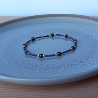 Thin miyuki stretch bracelets with blue crystal pearls, matte tiny glass beads and gold color beads, two designs in minimalist style