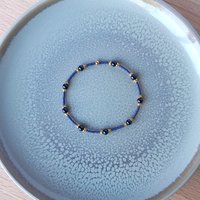 Thin miyuki stretch bracelets with blue crystal pearls, matte tiny glass beads and gold color beads, two designs in minimalist style