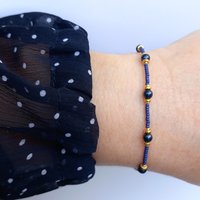 Thin miyuki stretch bracelets with blue crystal pearls, matte tiny glass beads and gold color beads, two designs in minimalist style