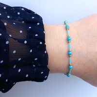 Thin miyuki stretch bracelets with blue crystal pearls, matte tiny glass beads and gold color beads, two designs in minimalist style