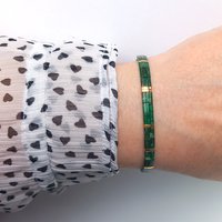 Elegant glass tile beads bracelet strung on transparent stretch cord using Japanese miyuki tila beads known for their high quality and precision  Two strands with square tile beads in picasso emerald green and gold-plated tila beads - elegant and comfortable for everyday use but also for your party outfit
