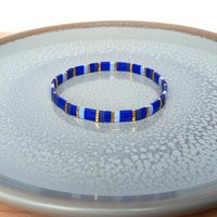 Glass tile stretch bracelet in shades of blue and gold-plated beads