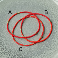 Delicate miyuki stretch bracelet in red with gold color accents, single or a set of bracelets, comfortable and light