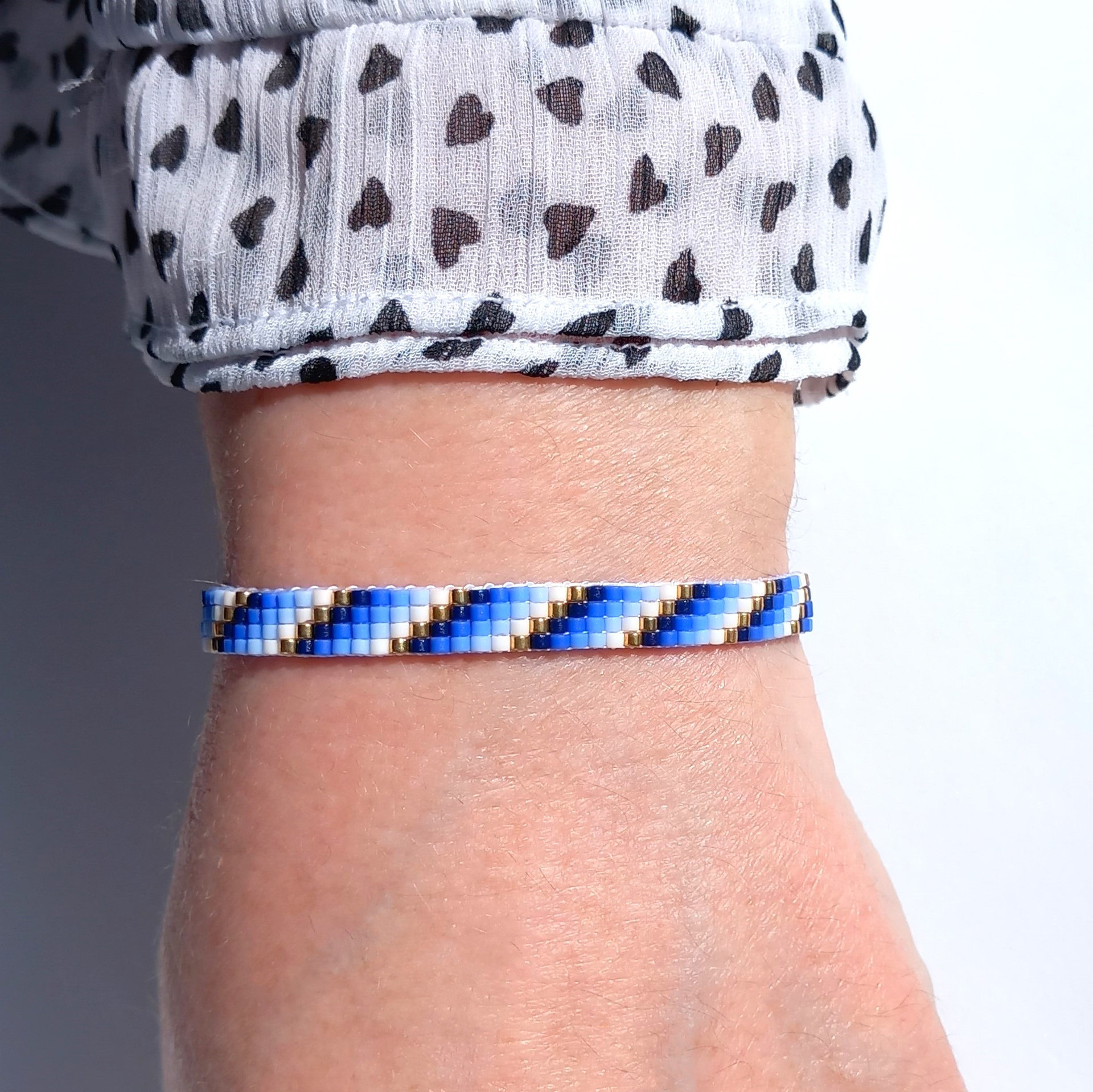 Glass beaded bracelet, summer jewelry of tiny blue, white and gold-color beads, adjustable loom bracelet with lobster claw clasp