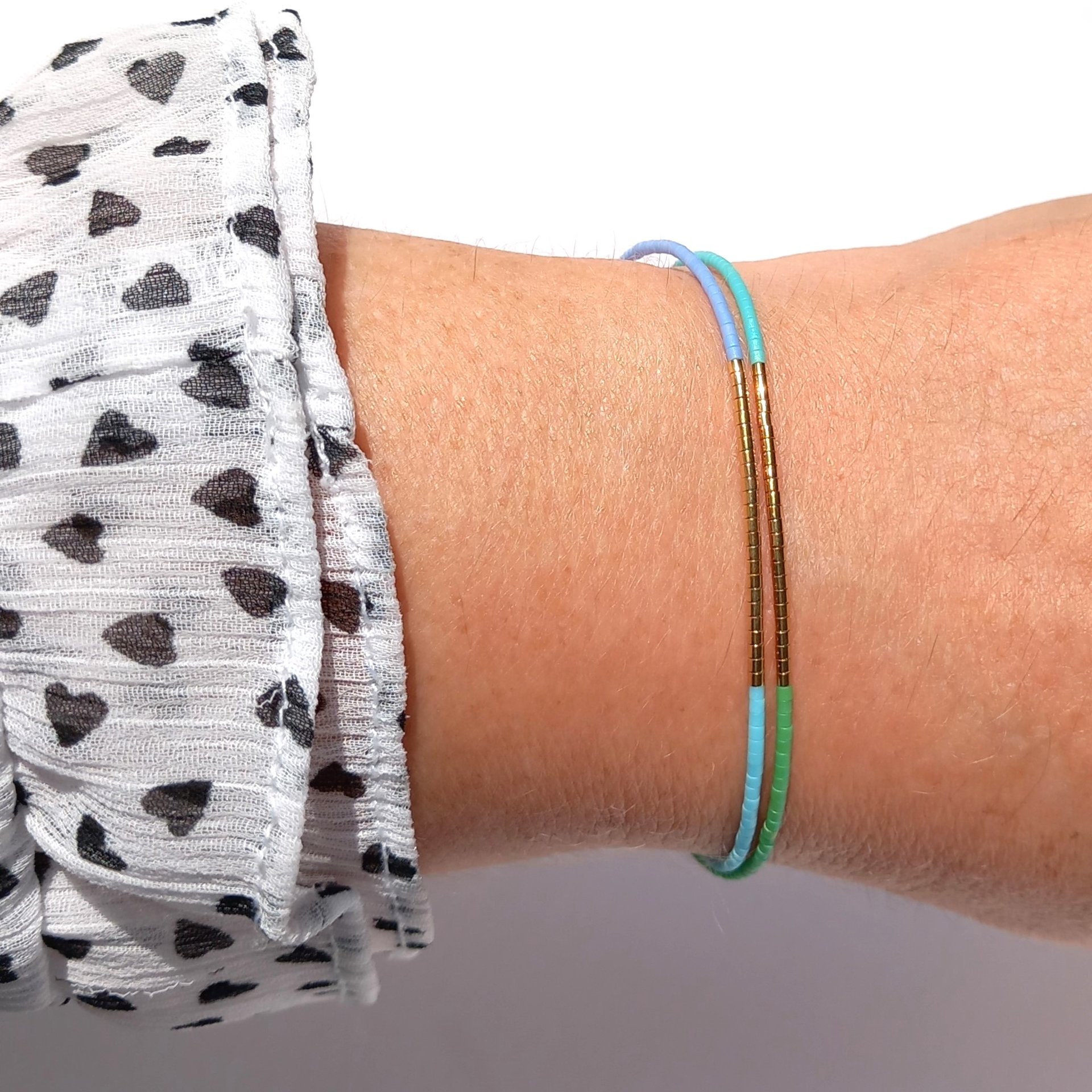 Thin miyuki wrapped stretch bracelet with blue, green and gold-plated tiny beads, minimalist summer jewelry
