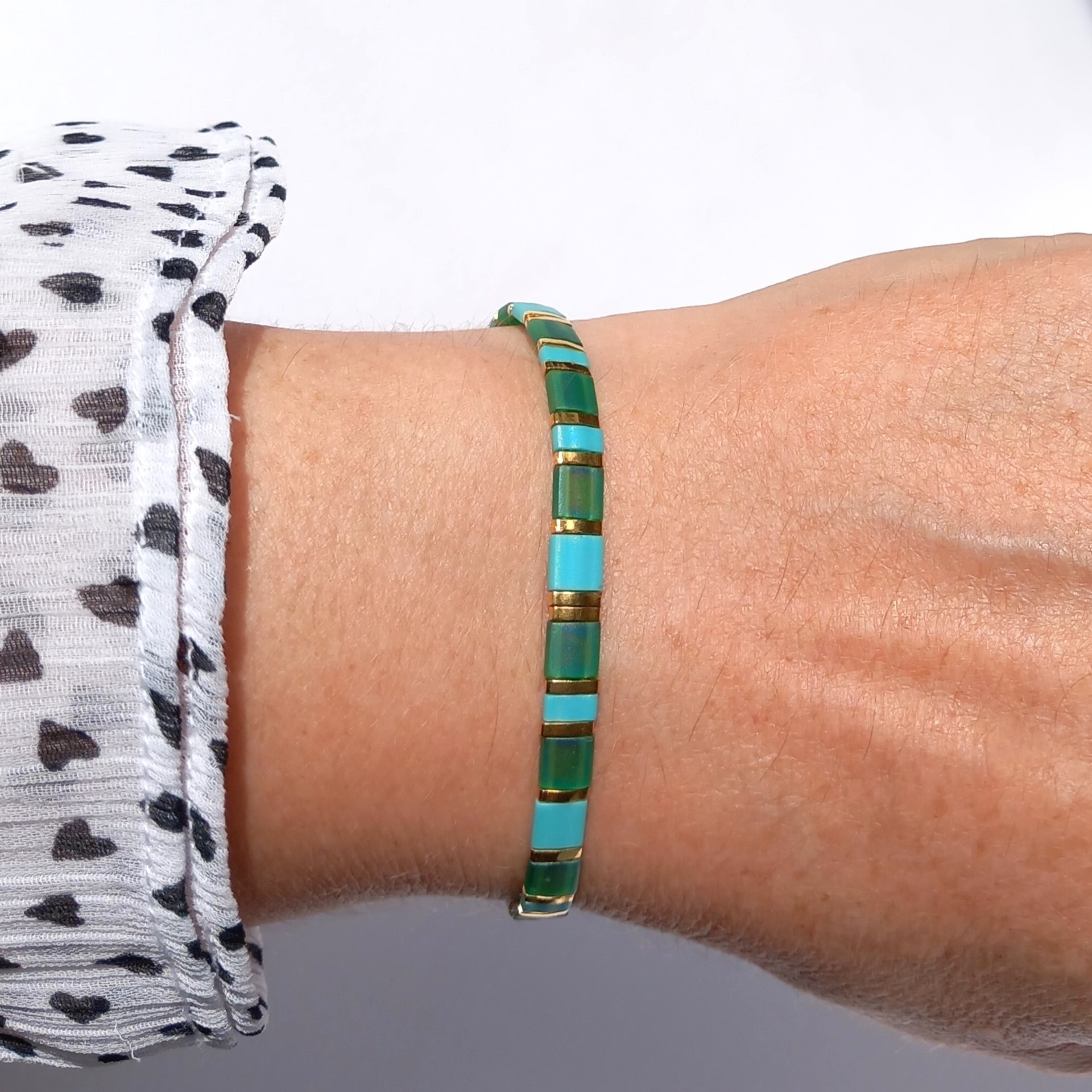 Miyuki tila stretch bracelet, emerald green, turquoise blue and gold-plated tila beads