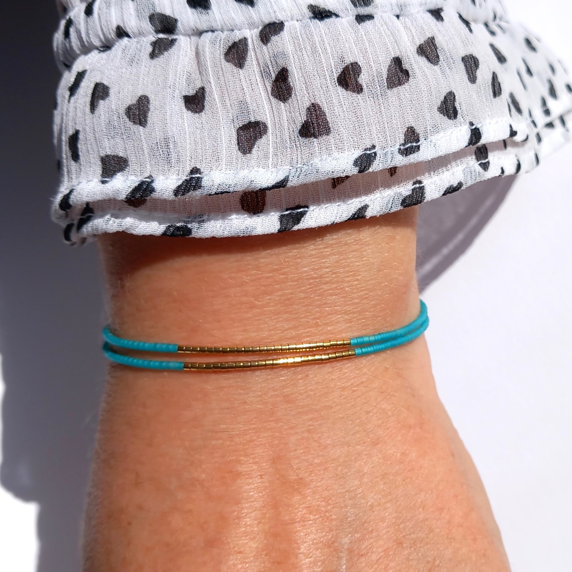 Thin miyuki stretch wrapped bracelet, summer jewelry of tiny blue-green teal beads and gold-plated beads, minimalist, comfortable and light