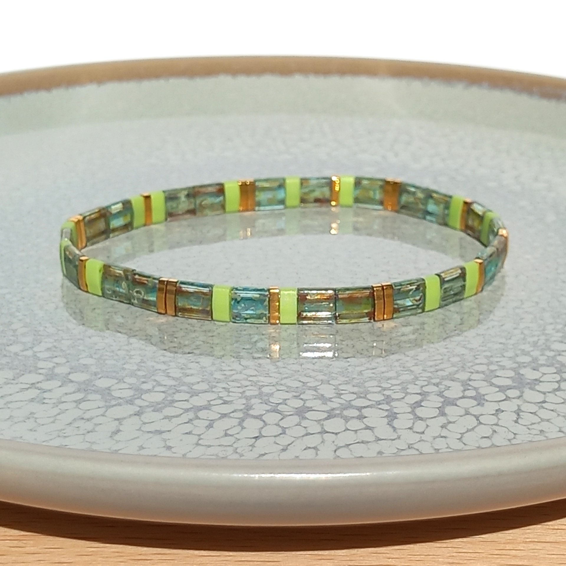 Miyuki tila stretch bracelet in chartreuse green and transparent sea foam colour with gold-plated tila beads