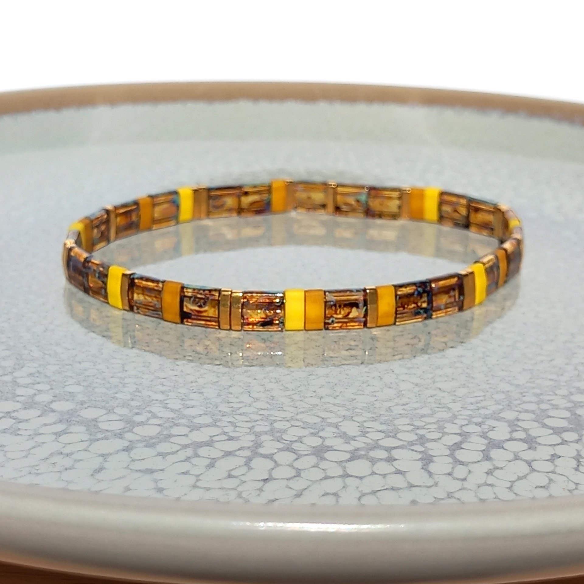 Miyuki tila stretch bracelet in warm yellow, mustard colour and topaz colour with gold-plated tila beads