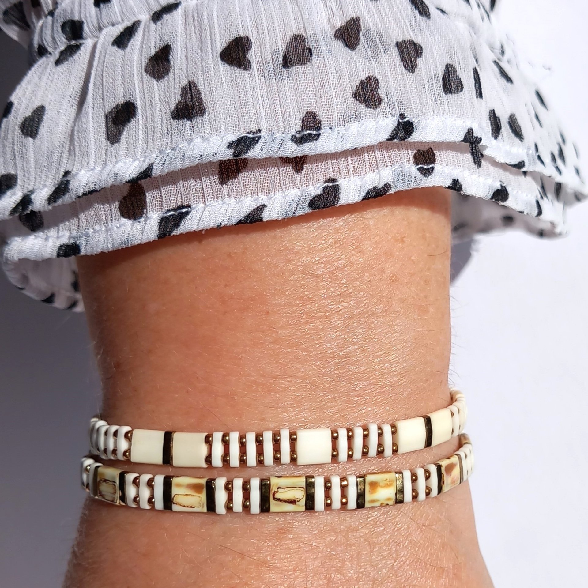 Elegant miyuki tila and rocaille bracelet set strung on transparent stretch cord  Two bracelets in matching colours; each bracelet is on two strands of stretch cord with light caramel and cream tila beads and tiny bronze colour rocaille beads  Handmade with care and attention to detail and made to order at your size  Available sizes: 15cm (5.9in), 16cm (6.3in), 17cm (6.7in), 18cm (7.1in)