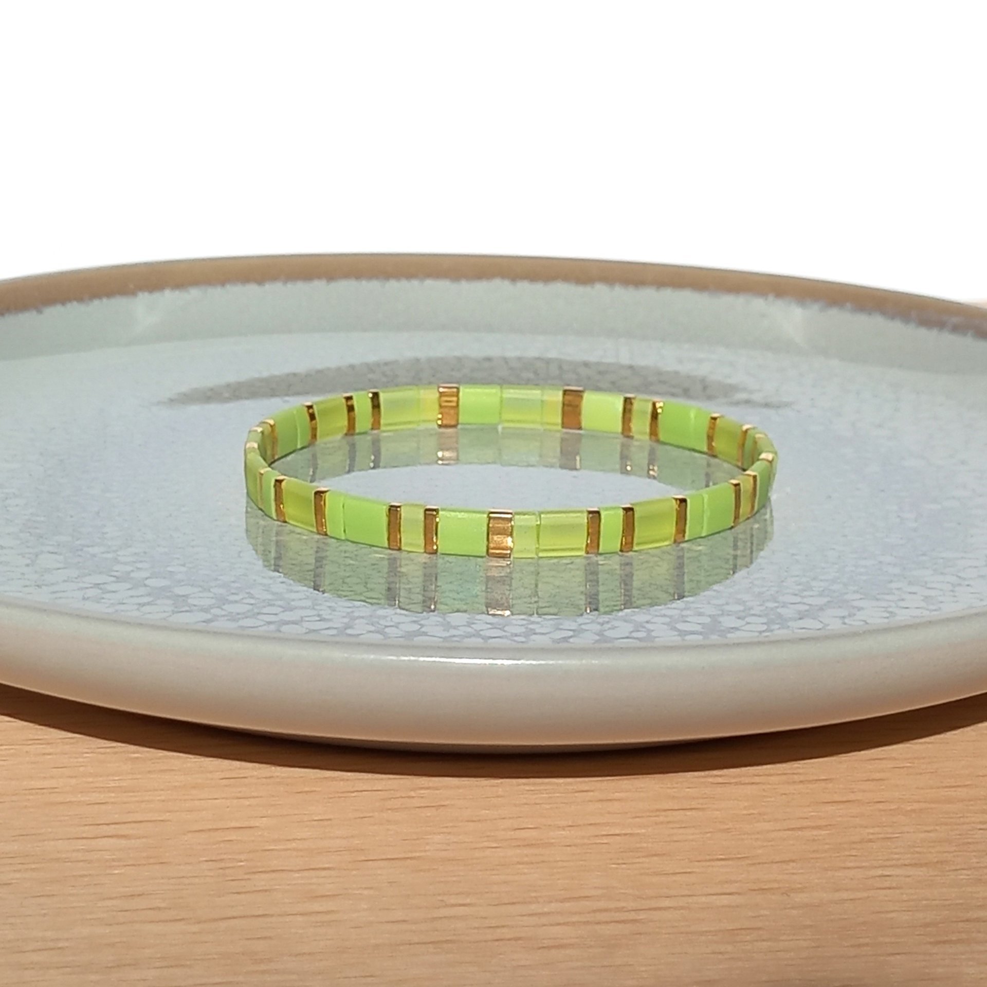 Miyuki tila stretch bracelet in light yellow and chartreuse green colour with gold-plated beads, two bracelets in sunny spring colors