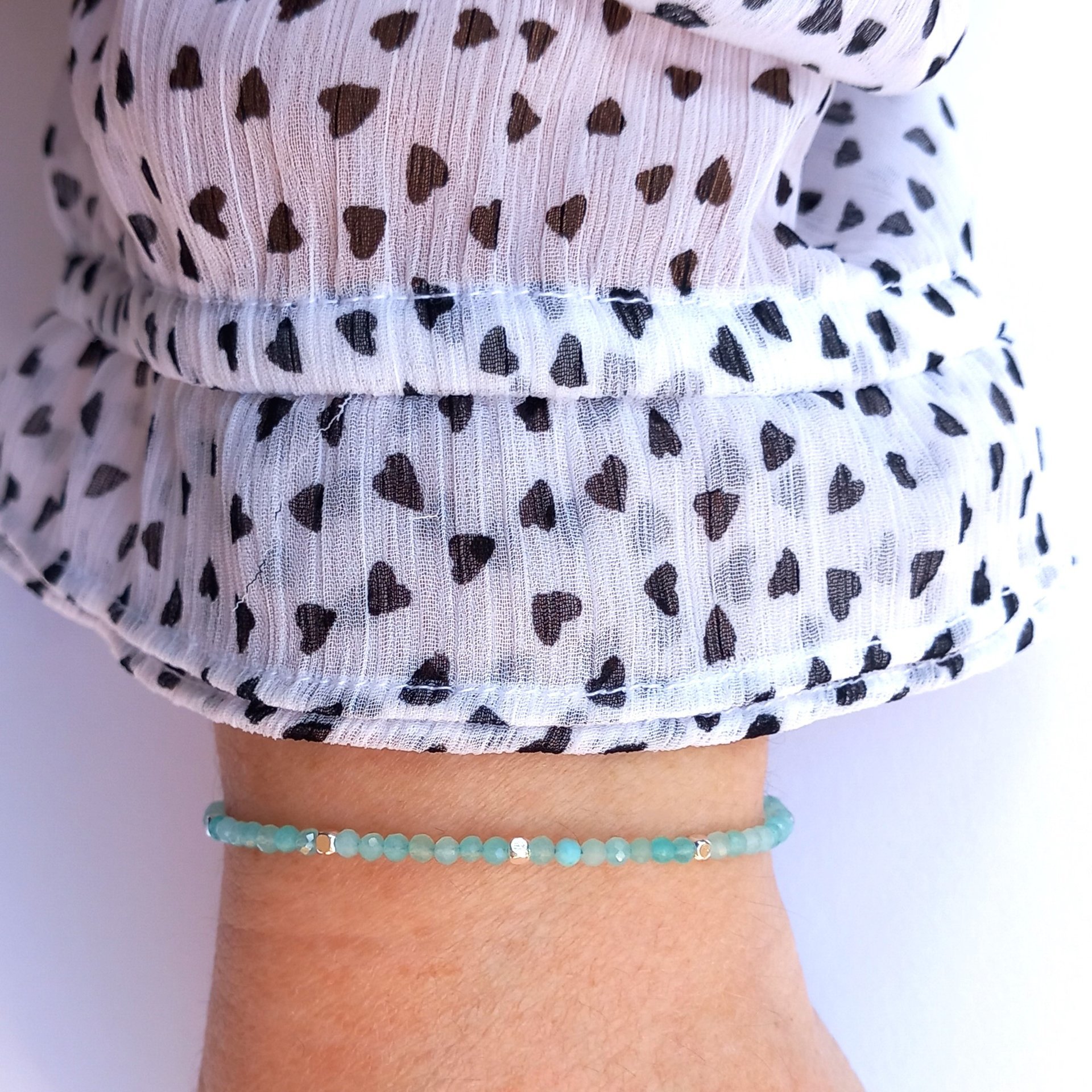 Thin gem bracelet with tiny faceted light blue-green jade and silver-plated cube-shaped beads, stainless steel lobster claw clasp