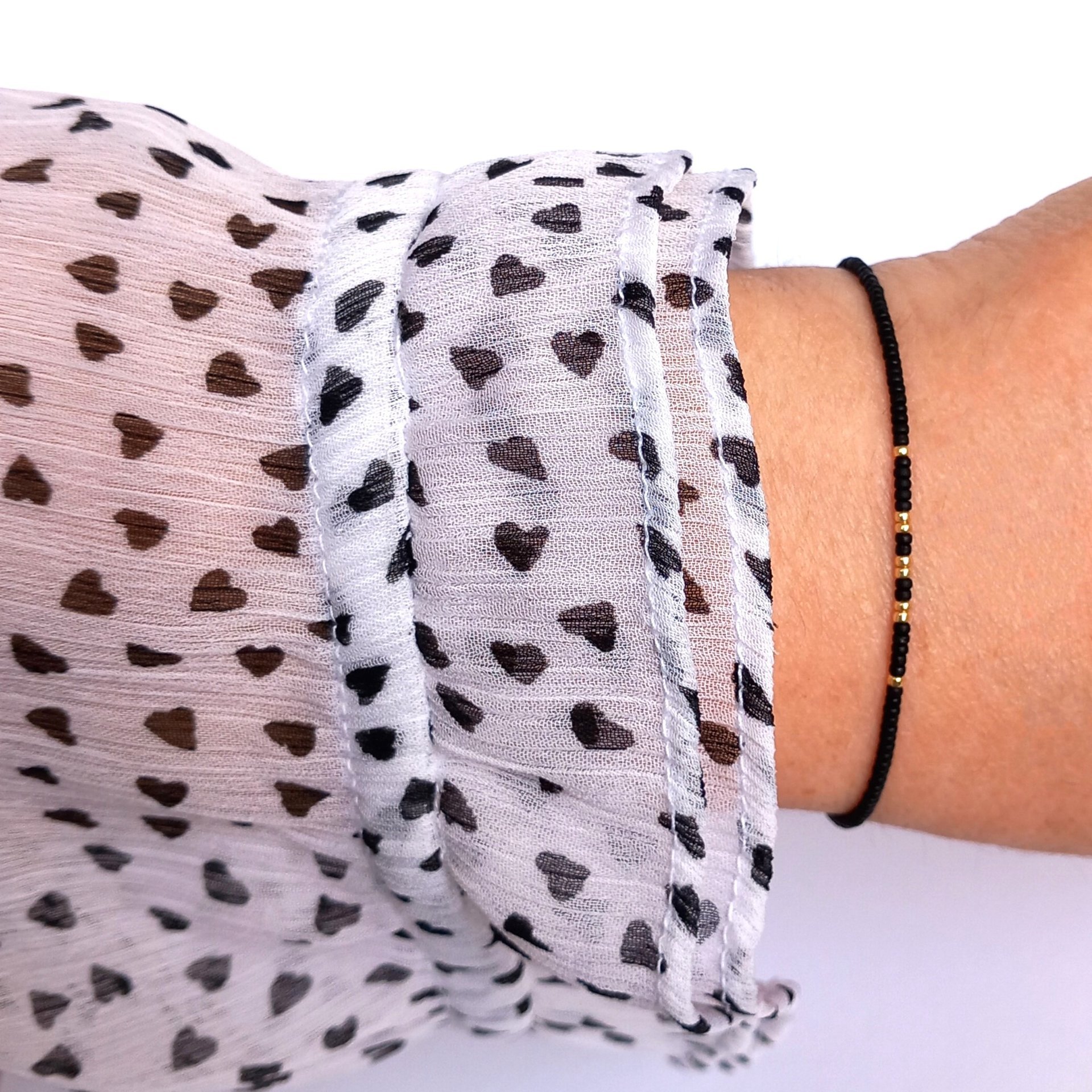 Thin miyuki stretch bracelets with matte black, gold, silver and bronze color tiny beads, four designs in minimalist style