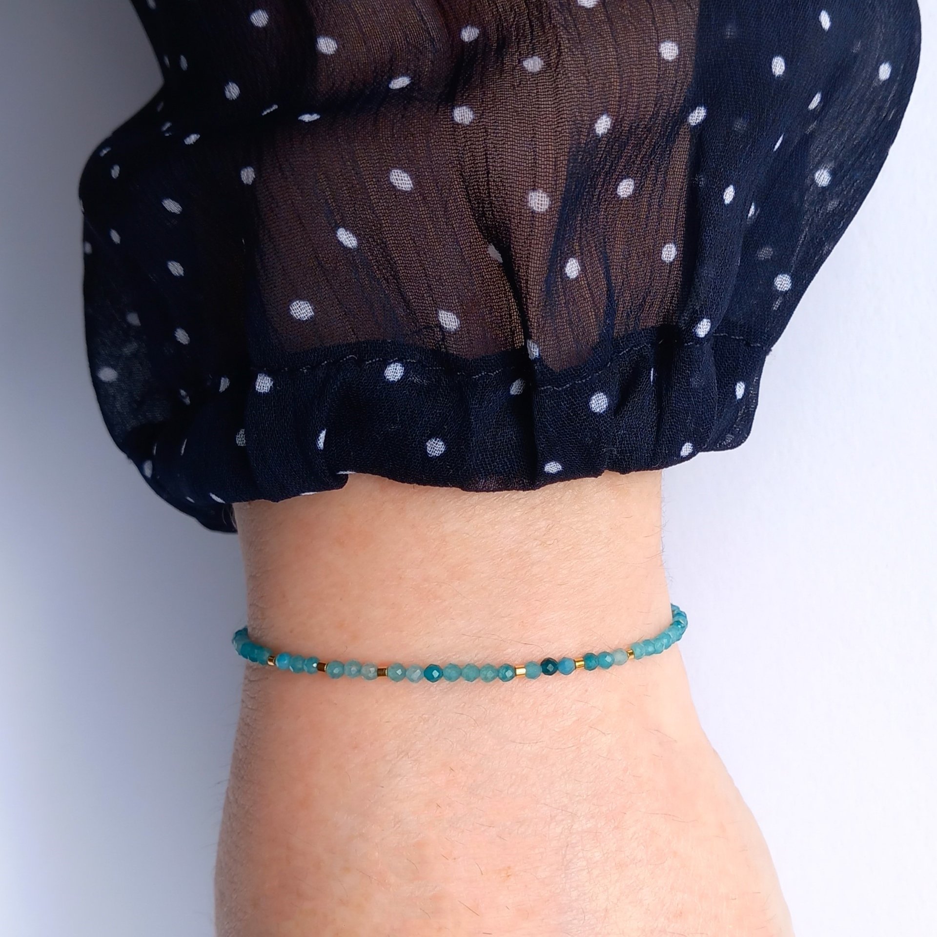Thin gem bracelet with tiny faceted light blue-green jade and gold-plated tiny beads, stainless steel lobster claw clasp