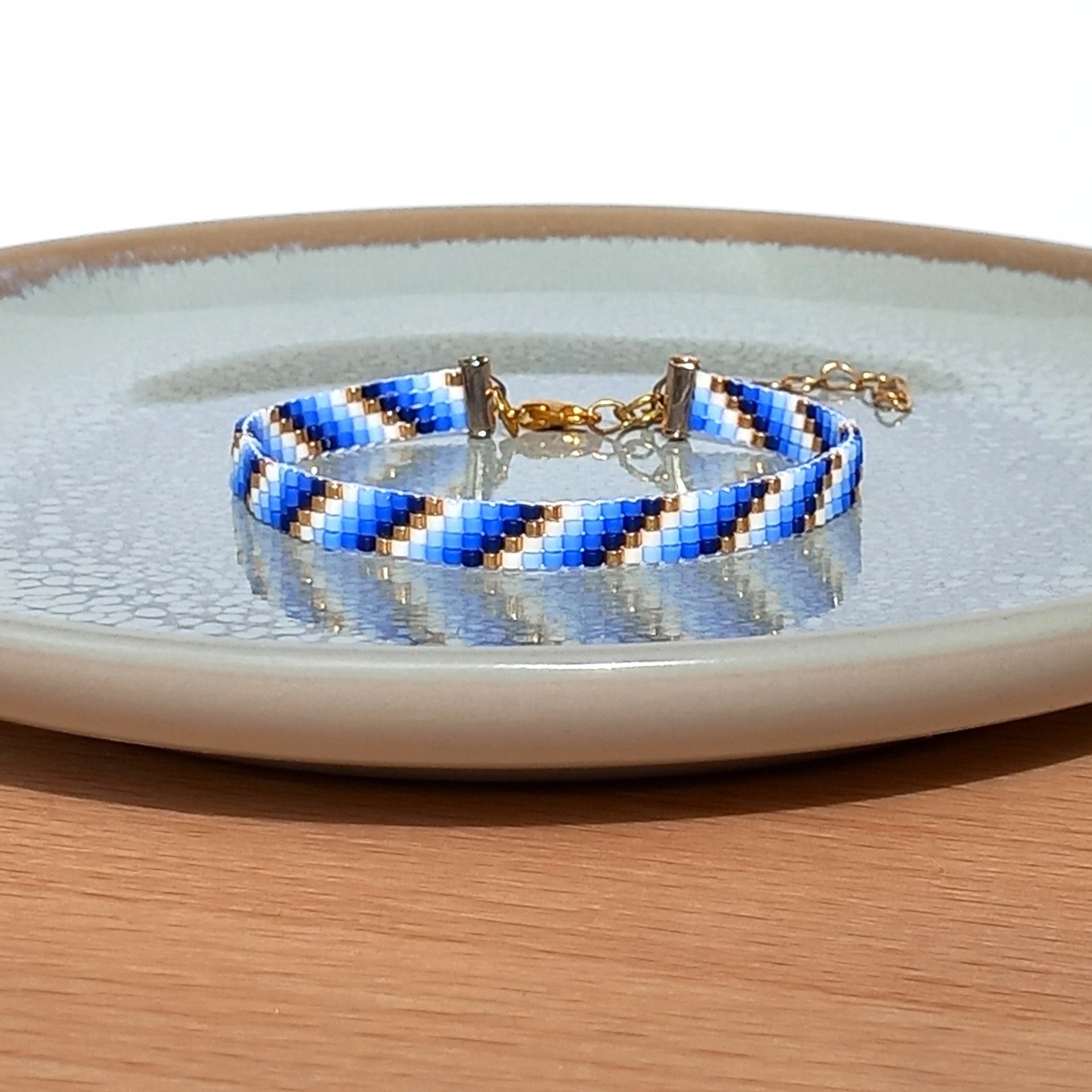Glass beaded bracelet, summer jewelry of tiny blue, white and gold-color beads, adjustable loom bracelet with lobster claw clasp