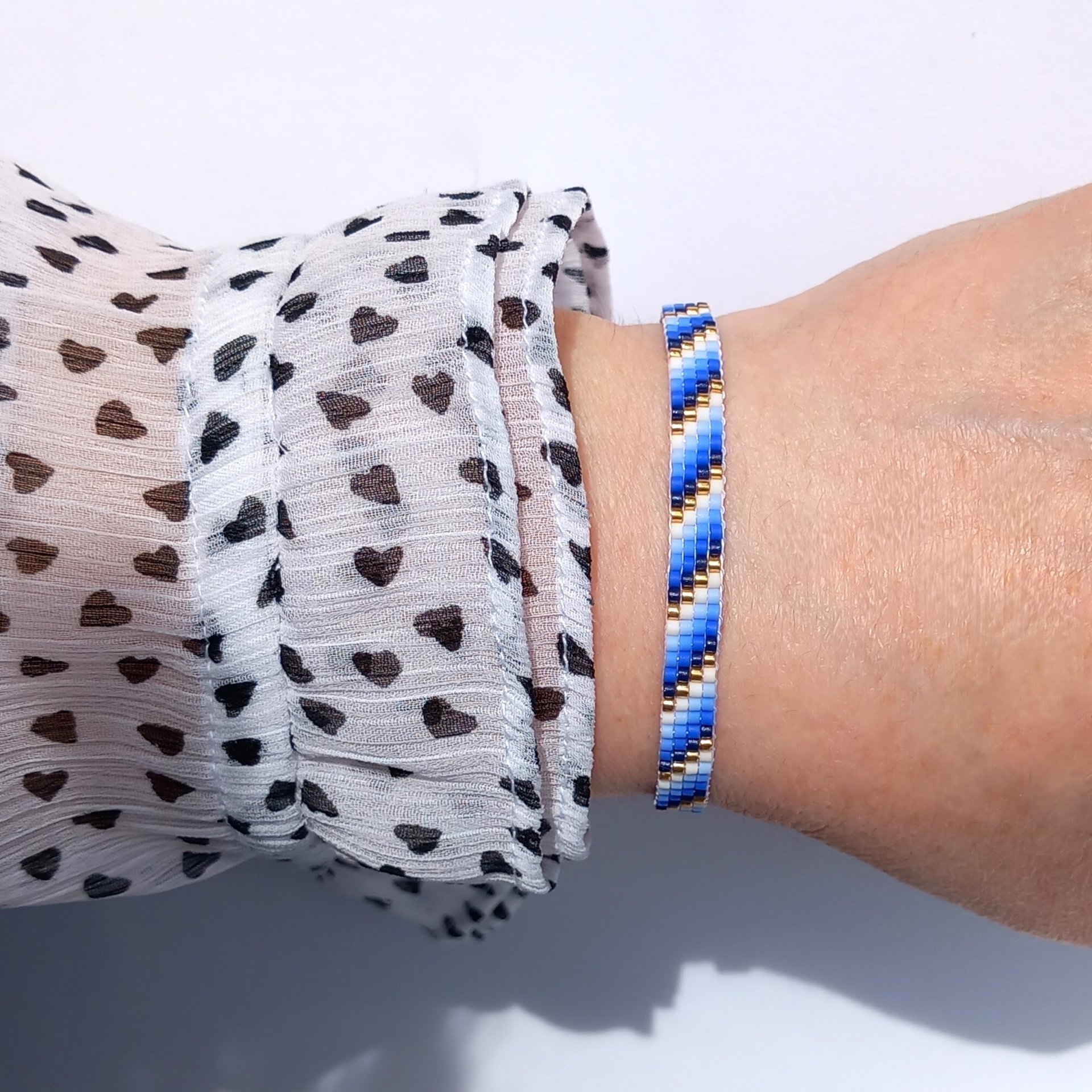 Glass beaded bracelet, summer jewelry of tiny blue, white and gold-color beads, adjustable loom bracelet with lobster claw clasp