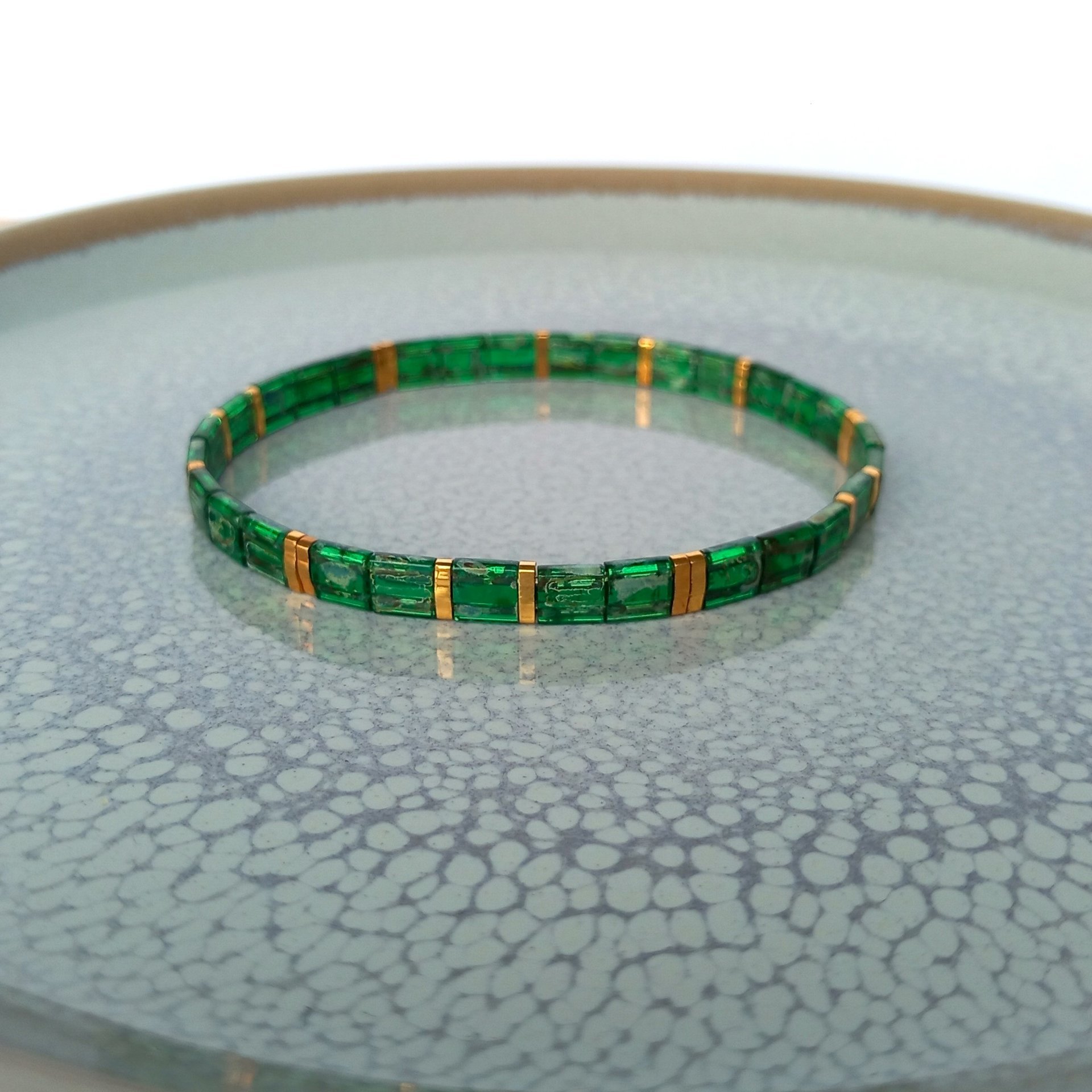 Glass tile stretch bracelet, emerald green and gold-plated miyuki tila beads