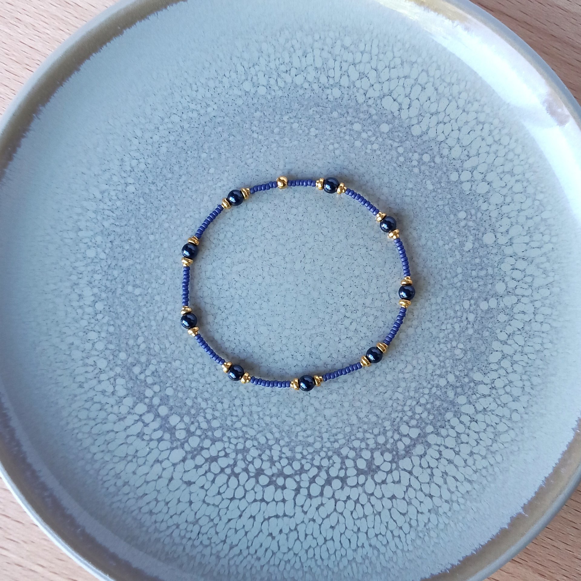 Thin miyuki stretch bracelets with blue crystal pearls, matte tiny glass beads and gold color beads, two designs in minimalist style
