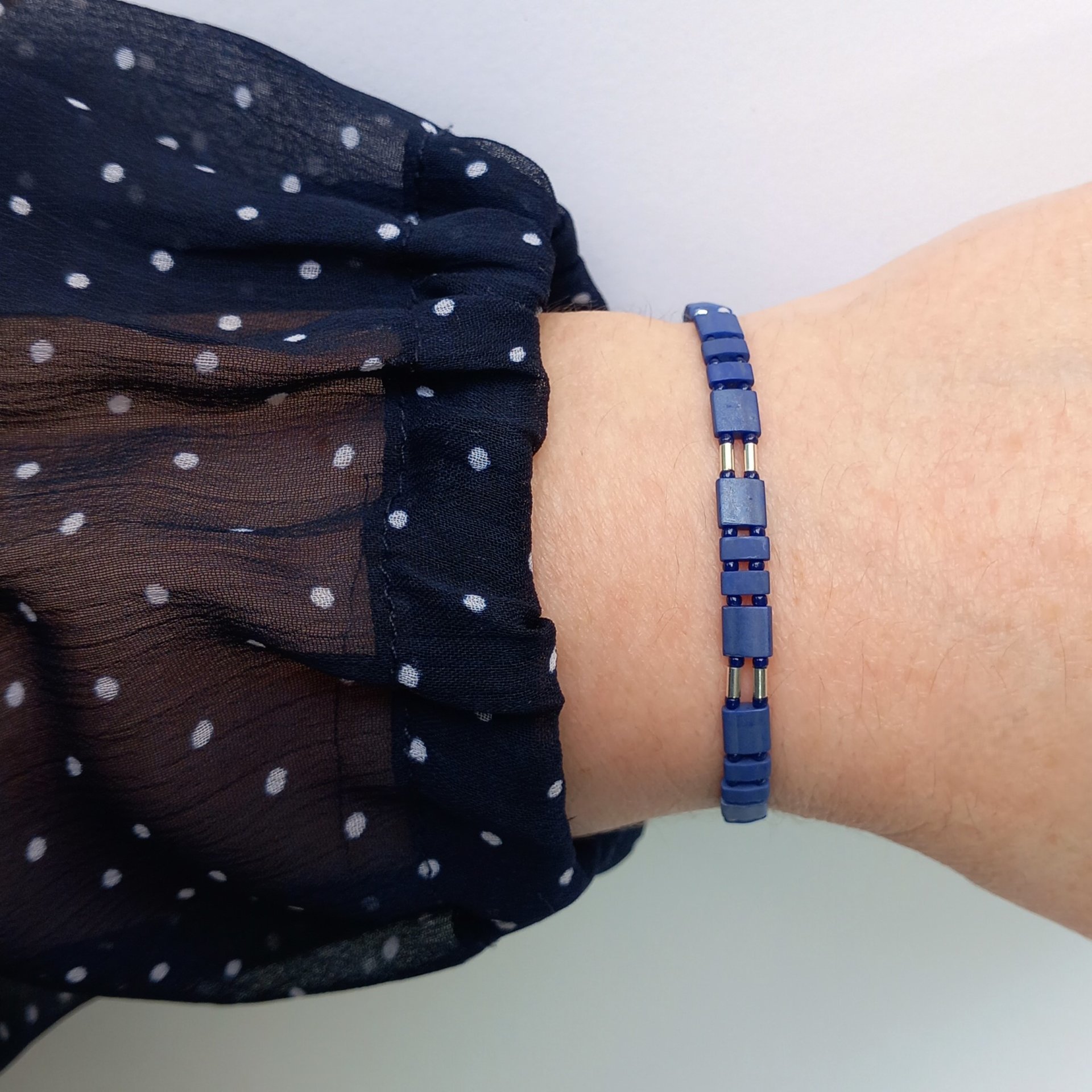 Miyuki tila stretch bracelet in matte dark navy blue and silver, with tila tile beads, tiny rocailles seed beads and thin tube beads