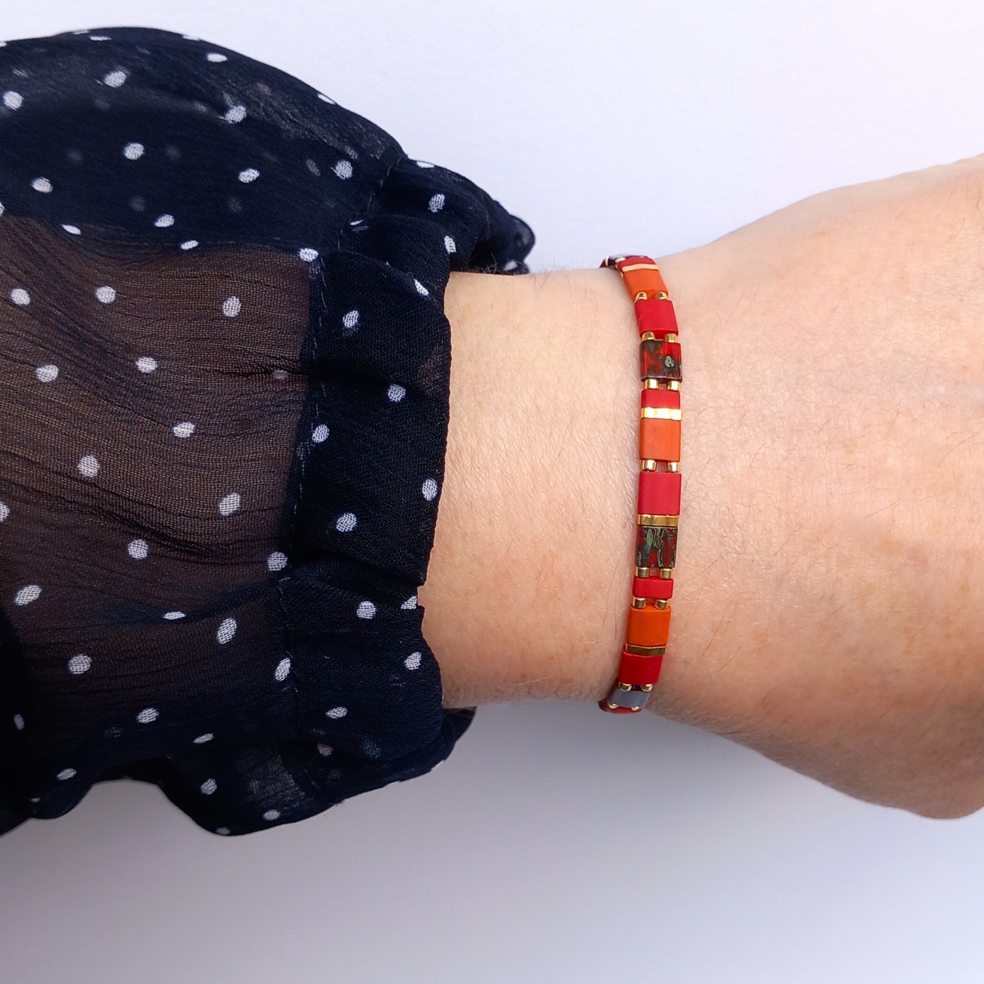 Elegant stretch miyuki bracelet, dark red, picasso red, orange and gold-plated tila beads