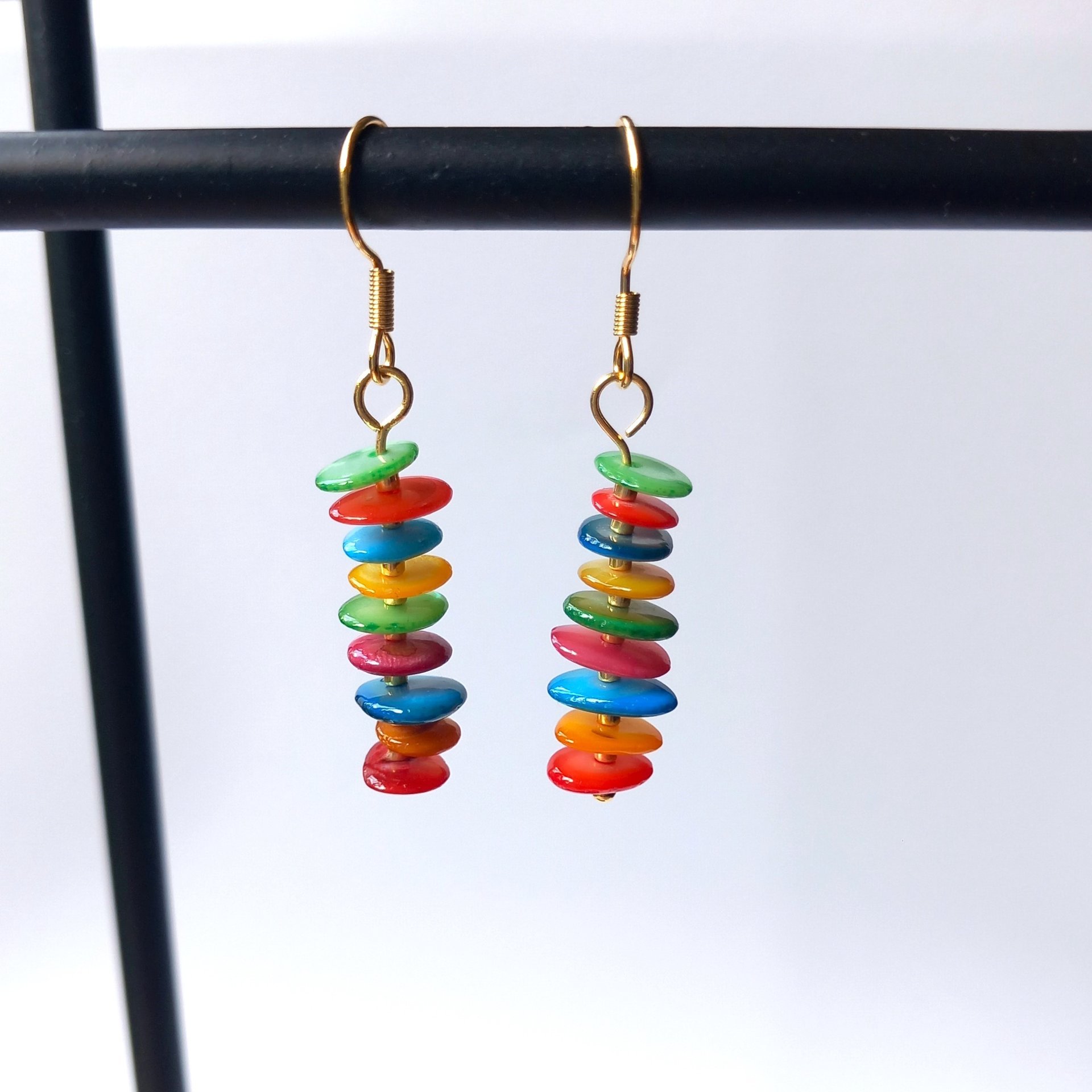 Colorful dangle earrings with dyed mother of pearl discs in bright colors, stainless steel wire hook in gold tone