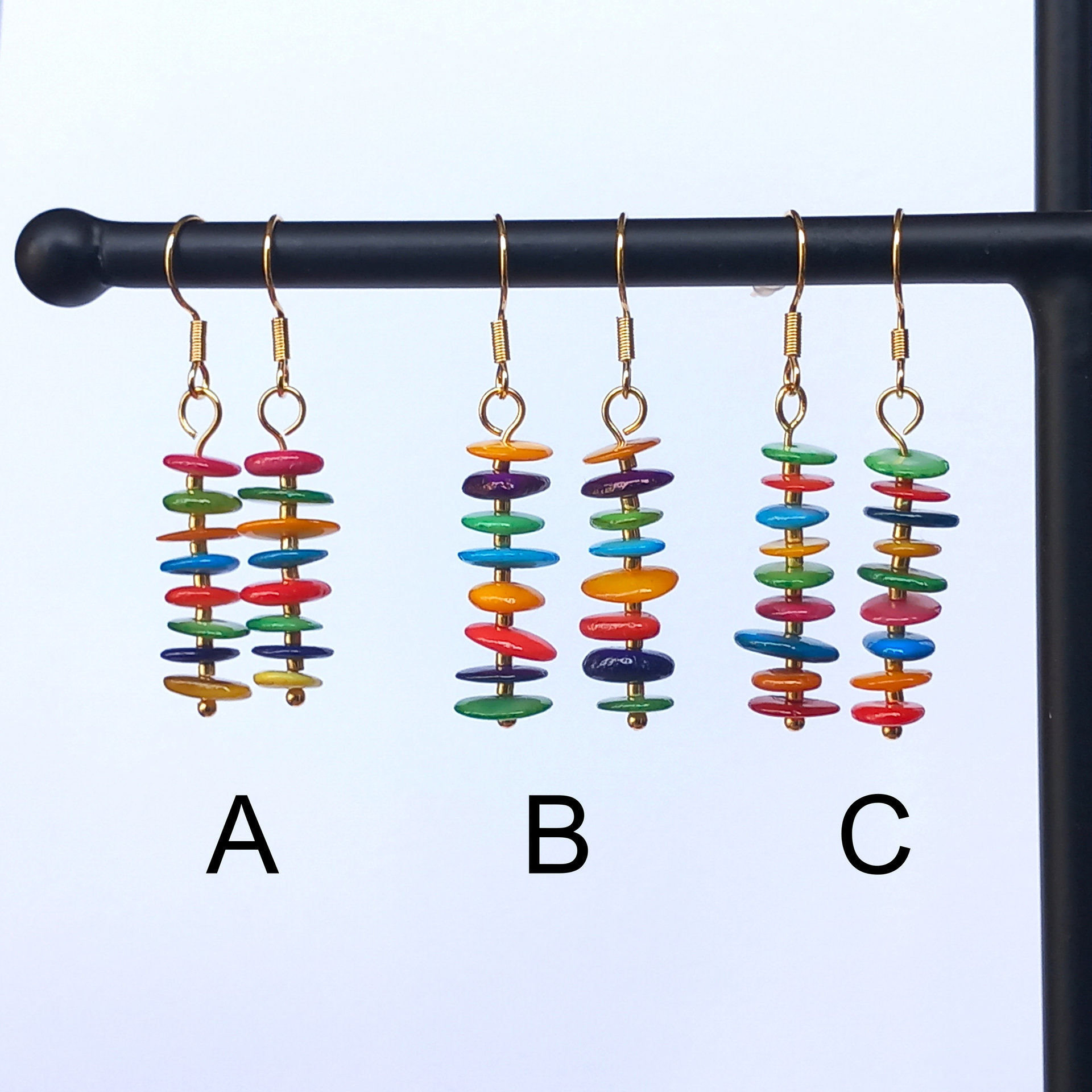 Colorful dangle earrings with dyed mother of pearl discs in bright colors, stainless steel wire hook in gold tone
