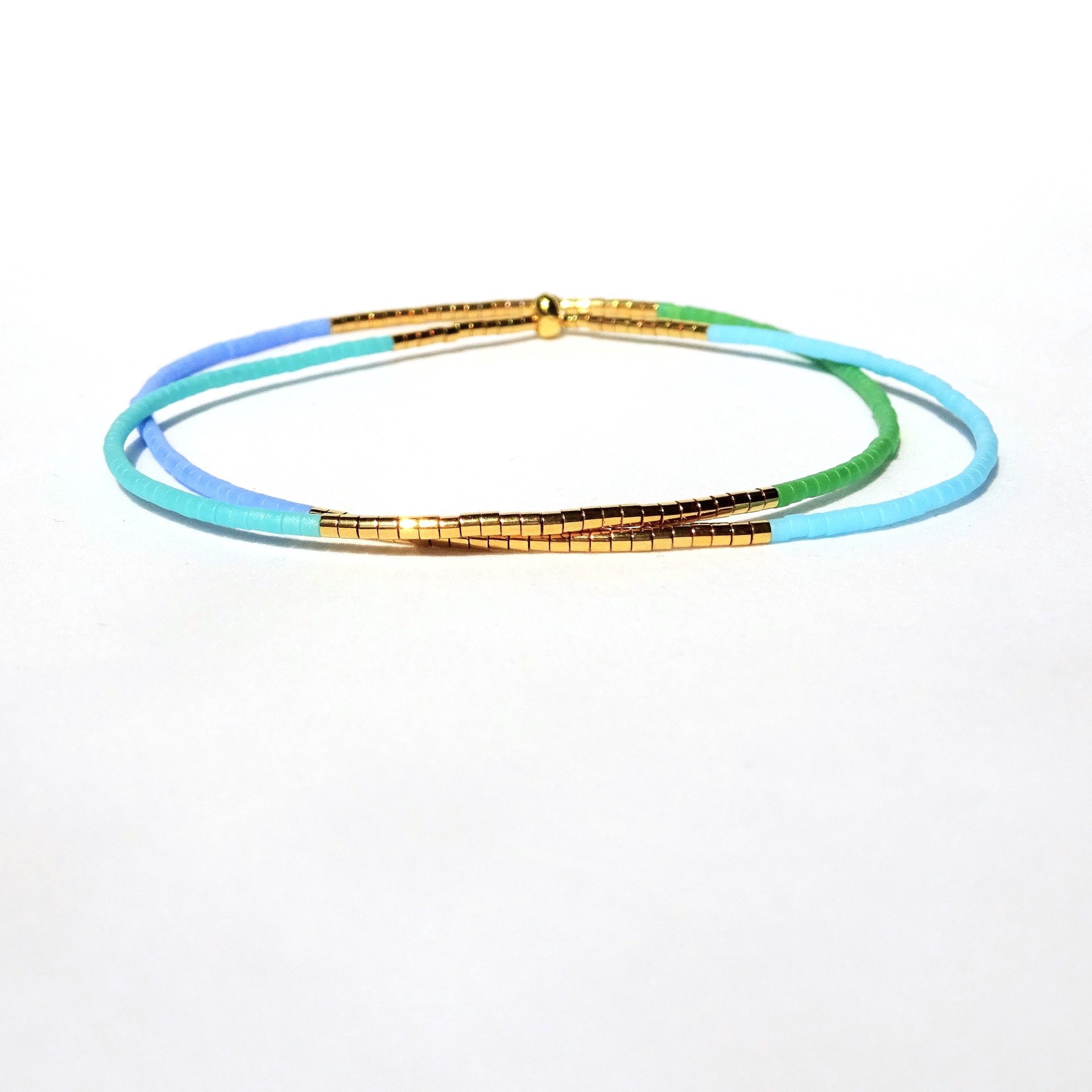 Thin miyuki wrapped stretch bracelet with blue, green and gold-plated tiny beads, minimalist summer jewelry