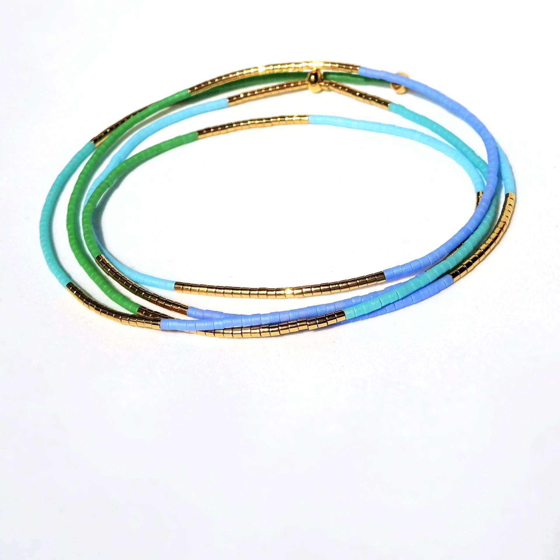 Thin miyuki wrapped stretch bracelet with blue, green and gold-plated tiny beads, minimalist summer jewelry