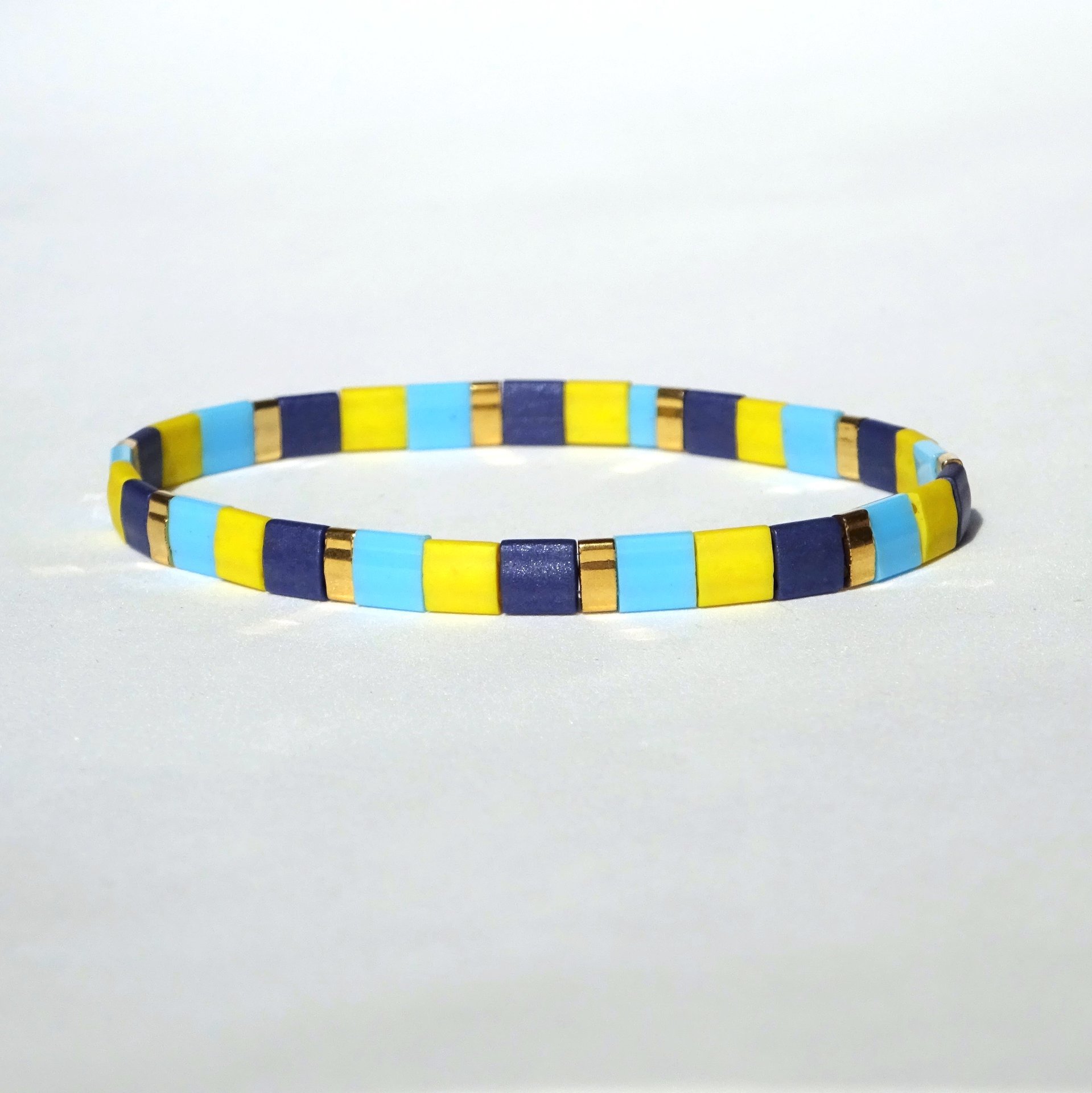 Miyuki tila stretch bracelet, turquoise blue, yellow, dark blue and gold-plated tila beads
