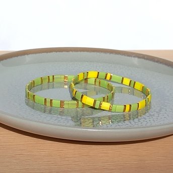 Miyuki tila stretch bracelet in light yellow and chartreuse green colour with gold-plated beads, two bracelets in sunny spring colors