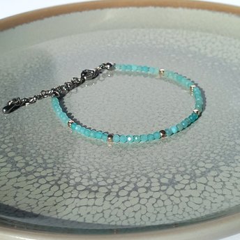 Thin gem bracelet with tiny faceted light blue-green jade and silver-plated cube-shaped beads, stainless steel lobster claw clasp