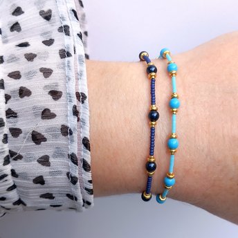 Thin miyuki stretch bracelets with blue crystal pearls, matte tiny glass beads and gold color beads, two designs in minimalist style