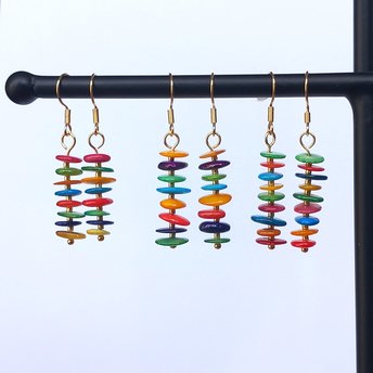 These happy colorful earrings have a pendant made of little thin mother of pearl (nacre/sea shell) discs. Dyed in various bright colors, they differ in size and shape, so your earrings will be unique. You can customize them and/or ask for a picture of your pair before they are shipped - please send a message to discuss the possibilities.  The length is about 4.5-5cm (~1.8-2in) including the hook and 3-3.5cm (~1.2-1.4in) without the hook (i.e. pendant only).  The earrings have a wire hook in gold tone.